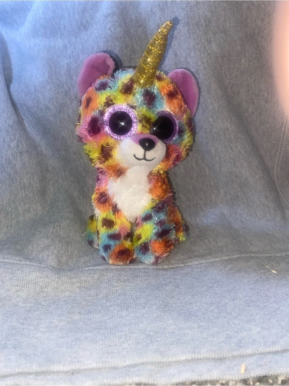 Gisselle, a rainbow lowland and unicorn hybrid plush